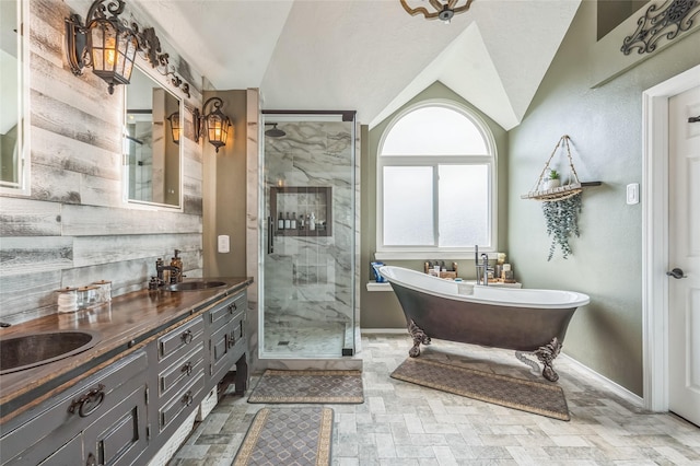 1914 Tipperary Dr, Deer Park, TX 77536 - bathroom with a stall shower, a freestanding tub, vaulted ceiling, double vanity, and baseboards