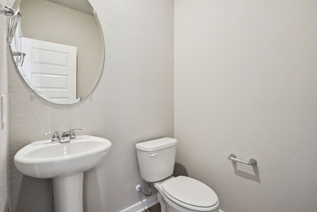 18737 Bliss Pl, New Caney, TX 77357 - half bathroom featuring toilet and baseboards