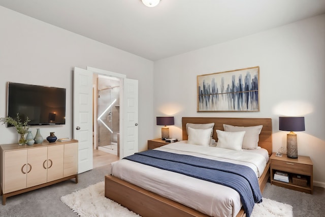 18737 Bliss Pl, New Caney, TX 77357 - carpeted bedroom featuring ensuite bath and baseboards