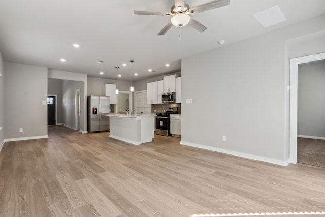 18737 Bliss Pl, New Caney, TX 77357 - unfurnished living room with light wood finished floors, recessed lighting, a ceiling fan, and baseboards