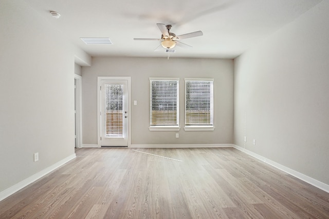 18737 Bliss Pl, New Caney, TX 77357 - spare room with ceiling fan, light wood-style floors, a smoke detector, and baseboards