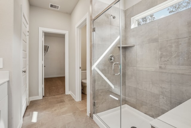 18737 Bliss Pl, New Caney, TX 77357 - full bathroom featuring a stall shower, toilet, a closet, and baseboards