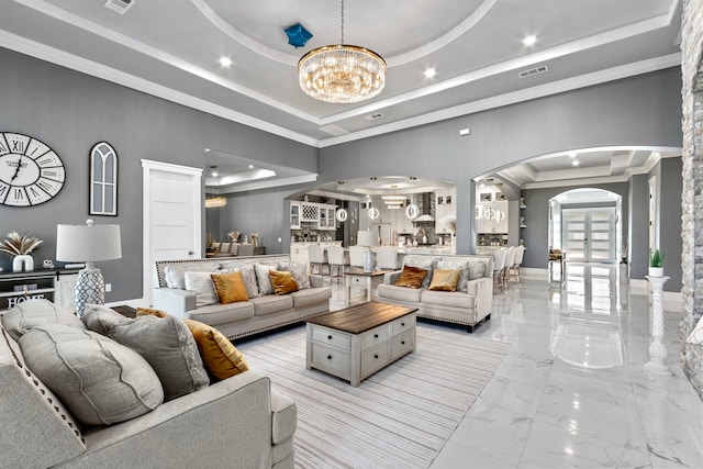 807 Steele Rd Unit A, Highlands, TX 77562 - living room featuring arched walkways, a raised ceiling, light marble finish flooring, recessed lighting, and a chandelier