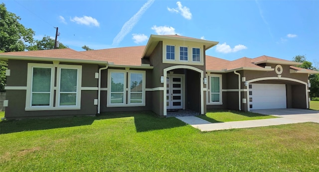 807 Steele Rd Unit A, Highlands, TX 77562 - view of front of house featuring stucco siding, concrete driveway, a garage, and a front yard