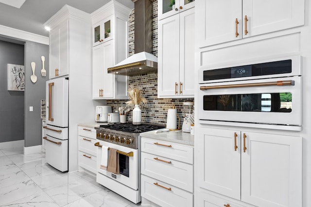 807 Steele Rd Unit A, Highlands, TX 77562 - kitchen with white appliances, wall chimney exhaust hood, baseboards, light marble finish flooring, and backsplash