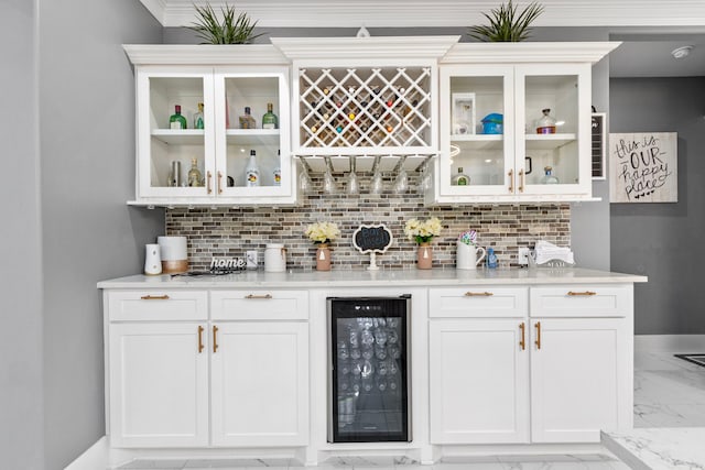807 Steele Rd Unit A, Highlands, TX 77562 - indoor dry bar with beverage cooler, light marble finish flooring, decorative backsplash, and baseboards