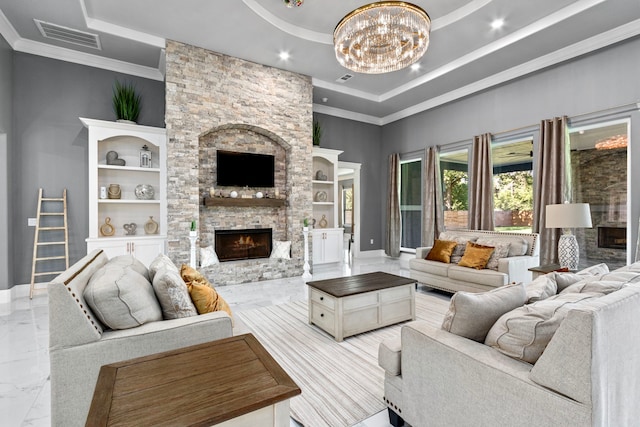 807 Steele Rd Unit A, Highlands, TX 77562 - living area with a tray ceiling, a fireplace, a chandelier, light marble finish floors, and recessed lighting