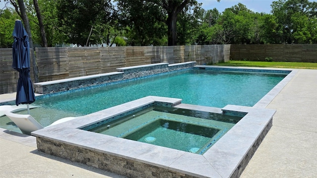 807 Steele Rd Unit A, Highlands, TX 77562 - view of swimming pool featuring a fenced backyard and a pool with connected hot tub