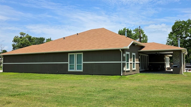 807 Steele Rd Unit A, Highlands, TX 77562 - back of house featuring roof with shingles and a yard