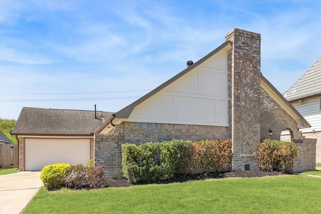 10830 Bob White Dr, Houston, TX 77096 - view of front facade with brick siding, a front yard, driveway, a chimney, and a garage