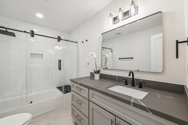 10830 Bob White Dr, Houston, TX 77096 - full bathroom featuring vanity, toilet, shower / bath combination with glass door, and recessed lighting