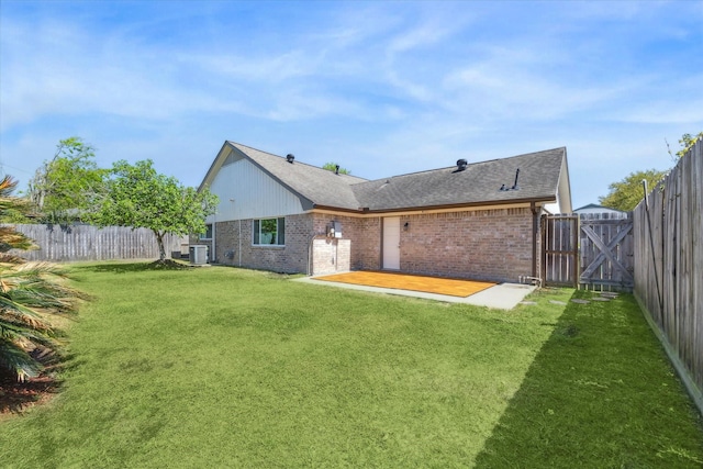 10830 Bob White Dr, Houston, TX 77096 - back of property with brick siding, central AC unit, a patio area, and a gate