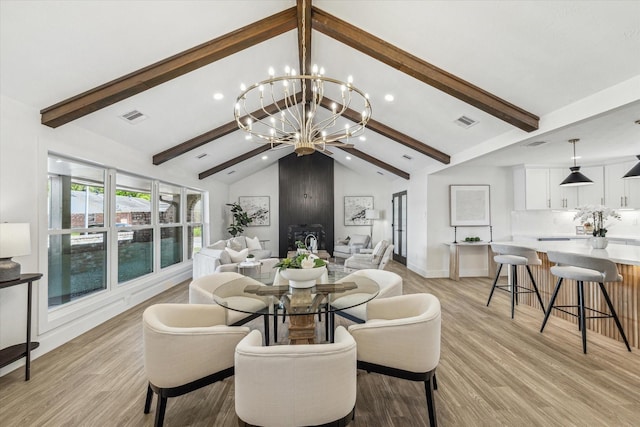 10830 Bob White Dr, Houston, TX 77096 - dining room with a chandelier, recessed lighting, light wood finished floors, and baseboards