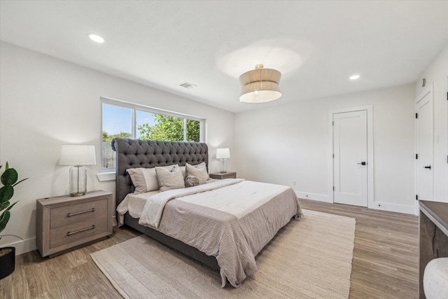 10830 Bob White Dr, Houston, TX 77096 - bedroom with wood finished floors, recessed lighting, and baseboards