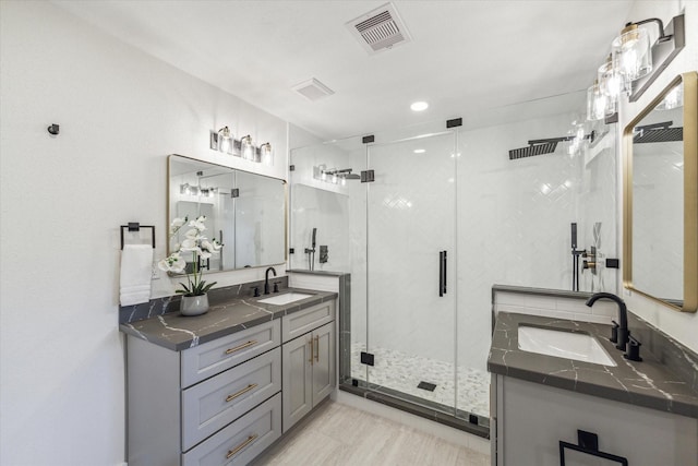 10830 Bob White Dr, Houston, TX 77096 - bathroom featuring a stall shower and two vanities