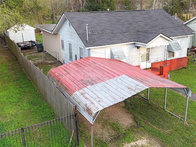 4145 Chaison St, Beaumont, TX 77705 - rear view of property with roof with shingles