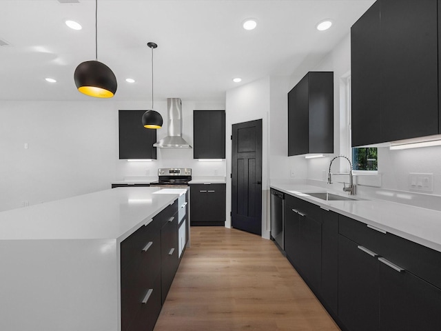10732 Twin Oaks Dr, Conroe, TX 77385 - kitchen with wall chimney range hood, a sink, dark cabinetry, modern cabinets, and recessed lighting