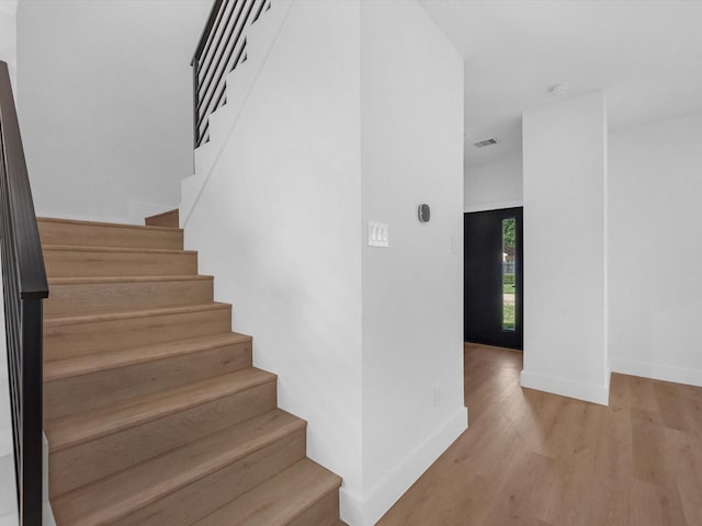 10732 Twin Oaks Dr, Conroe, TX 77385 - staircase featuring wood finished floors and baseboards