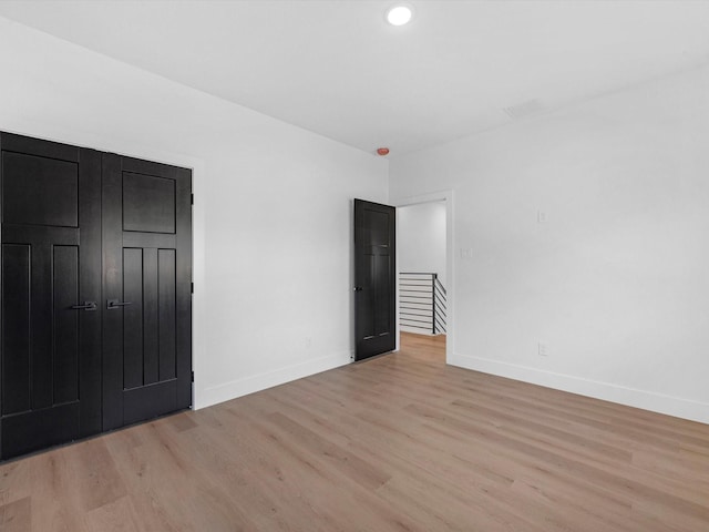 10732 Twin Oaks Dr, Conroe, TX 77385 - unfurnished bedroom featuring light wood-style floors, baseboards, and recessed lighting