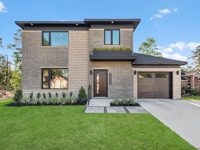 10732 Twin Oaks Dr, Conroe, TX 77385 - contemporary home with concrete driveway, brick siding, a front lawn, and a garage