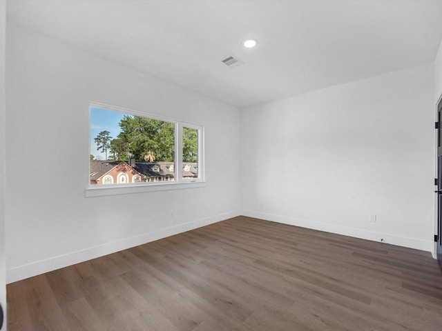 10732 Twin Oaks Dr, Conroe, TX 77385 - spare room with wood finished floors, baseboards, and recessed lighting