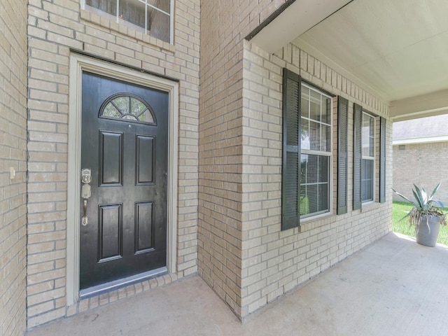 24247 Silversmith Ln, Katy, TX 77493 - view of exterior entry with brick siding and covered porch