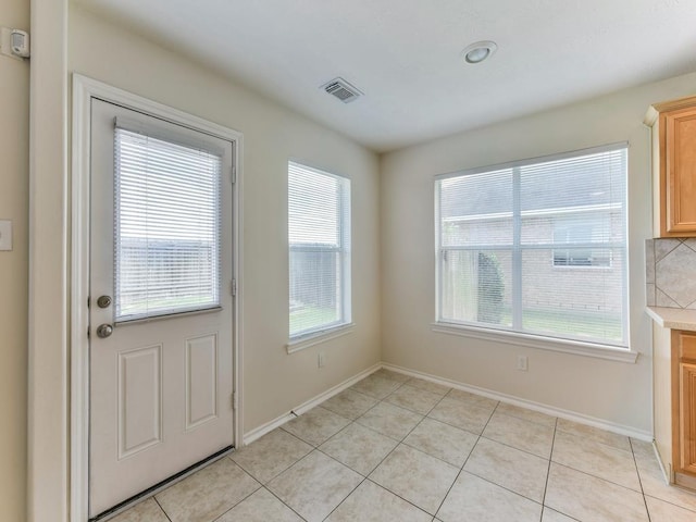 24247 Silversmith Ln, Katy, TX 77493 - entryway featuring healthy amount of natural light, baseboards, and light tile patterned floors