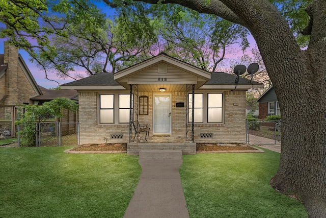 512 Gale St, Houston, TX 77009 - bungalow with a gate, brick siding, and a shingled roof