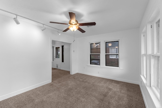 512 Gale St, Houston, TX 77009 - unfurnished room featuring track lighting, carpet floors, a ceiling fan, and baseboards
