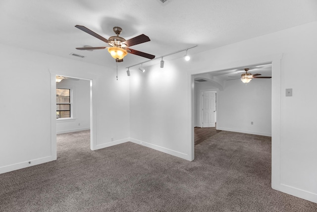 512 Gale St, Houston, TX 77009 - unfurnished room featuring a ceiling fan, carpet, track lighting, and baseboards