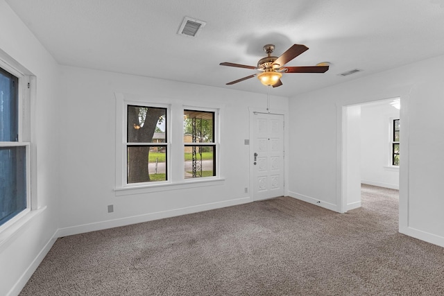 512 Gale St, Houston, TX 77009 - unfurnished room with carpet floors, healthy amount of natural light, and a ceiling fan