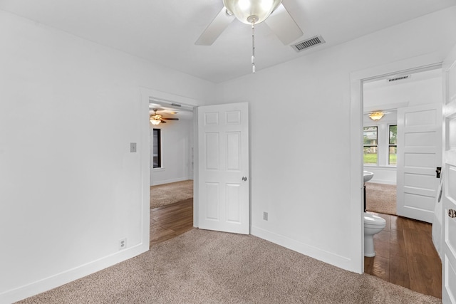 512 Gale St, Houston, TX 77009 - unfurnished bedroom featuring dark colored carpet, baseboards, and ensuite bathroom