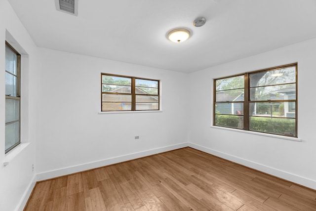 512 Gale St, Houston, TX 77009 - empty room with light wood-type flooring, healthy amount of natural light, and baseboards