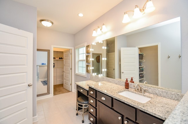 25292 Willow Creek Rd, Hockley, TX 77447 - full bath featuring a spacious closet, vanity, and tile patterned flooring