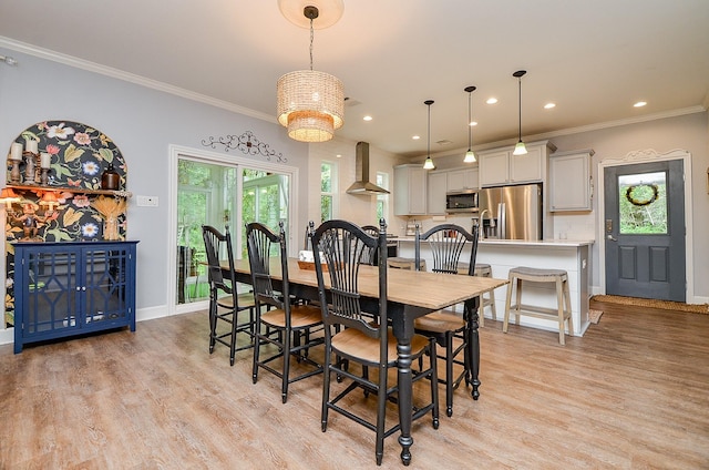 25292 Willow Creek Rd, Hockley, TX 77447 - dining room with healthy amount of natural light, light wood-style flooring, baseboards, ornamental molding, and recessed lighting