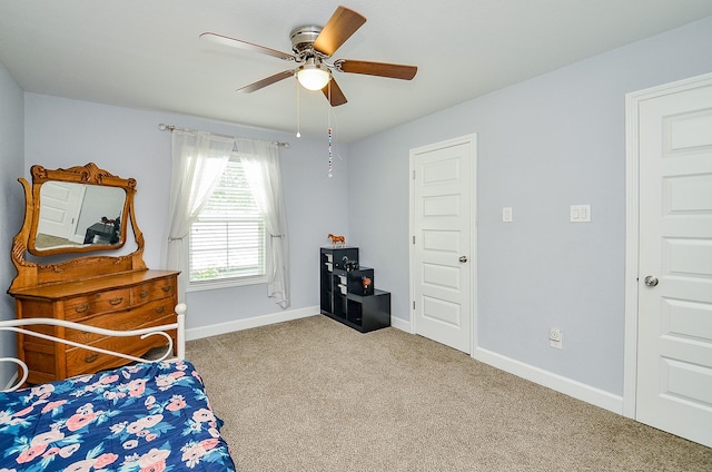 25292 Willow Creek Rd, Hockley, TX 77447 - bedroom with carpet, baseboards, and a ceiling fan