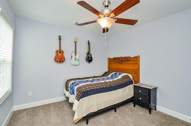 25292 Willow Creek Rd, Hockley, TX 77447 - carpeted bedroom with baseboards and ceiling fan