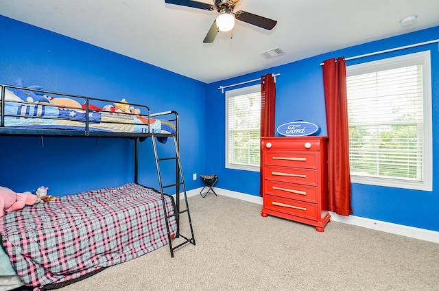 25292 Willow Creek Rd, Hockley, TX 77447 - bedroom with carpet flooring, baseboards, and a ceiling fan