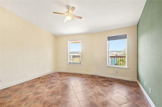 1504 W Saint Louis Ave, Seadrift, TX 77983 - unfurnished room with plenty of natural light, a ceiling fan, and baseboards