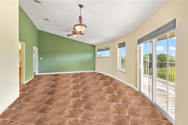 1504 W Saint Louis Ave, Seadrift, TX 77983 - empty room with baseboards, lofted ceiling, a ceiling fan, and dark tile patterned floors