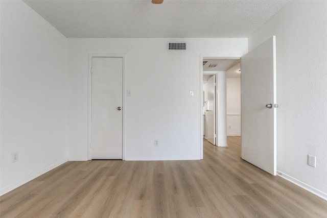10051 Westpark Dr Unit 274, Houston, TX 77042 - spare room featuring light wood finished floors and baseboards