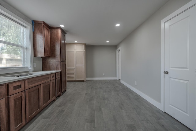 2127 Strawberry Rd, Pasadena, TX 77502 - kitchen featuring recessed lighting, wood finished floors, light countertops, and baseboards
