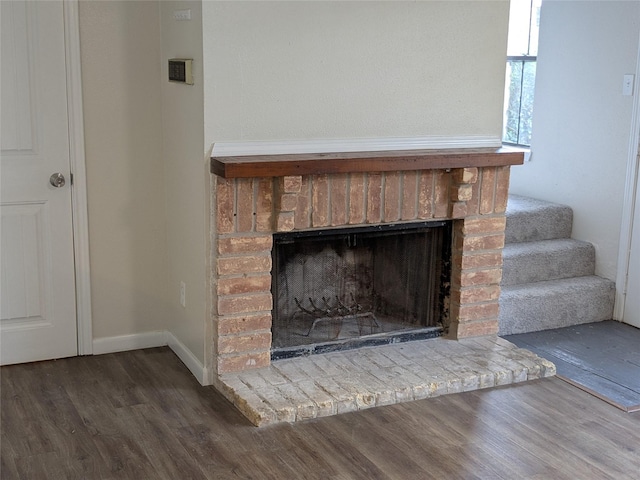 782 Worthshire St, Houston, TX 77008 - detailed view of wood finished floors, a fireplace, and baseboards
