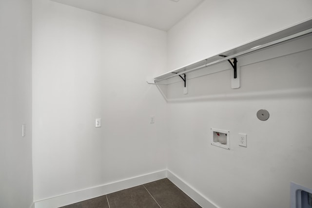 10728 Twin Oak Dr, Conroe, TX 77385 - washroom featuring hookup for a washing machine, baseboards, dark tile patterned flooring, and hookup for a gas dryer