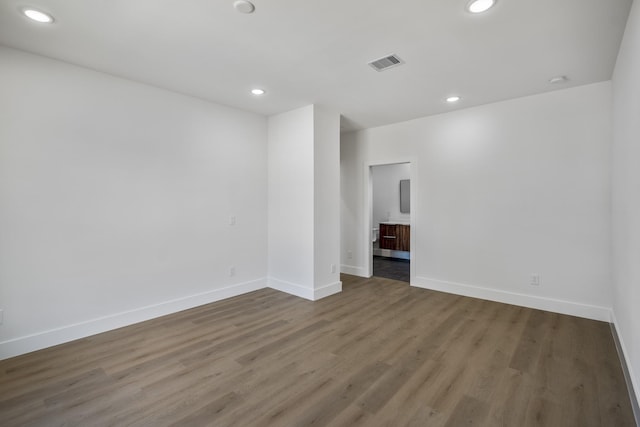 10728 Twin Oak Dr, Conroe, TX 77385 - spare room with wood finished floors, baseboards, and recessed lighting