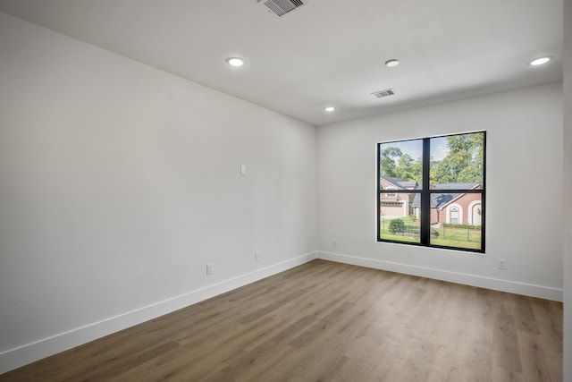 10728 Twin Oak Dr, Conroe, TX 77385 - unfurnished room with recessed lighting, baseboards, and wood finished floors