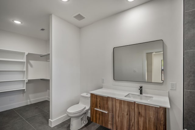 10728 Twin Oak Dr, Conroe, TX 77385 - bathroom with vanity, toilet, tile patterned flooring, recessed lighting, and baseboards