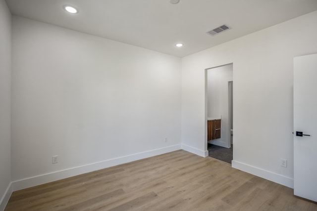 10728 Twin Oak Dr, Conroe, TX 77385 - unfurnished room with light wood finished floors, baseboards, and recessed lighting