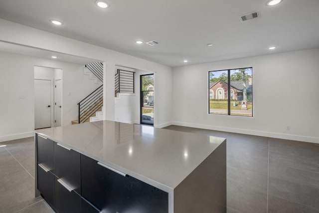 10728 Twin Oak Dr, Conroe, TX 77385 - kitchen with dark cabinets, modern cabinets, recessed lighting, healthy amount of natural light, and a kitchen island