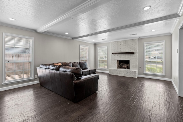 5610 Oakhaven Ln, Houston, TX 77091 - living room with a textured ceiling, crown molding, dark wood-type flooring, baseboards, and healthy amount of natural light